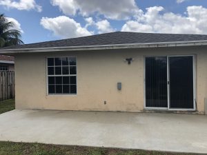 Backyard deck after pressure Cleaning services in Coconut Creek